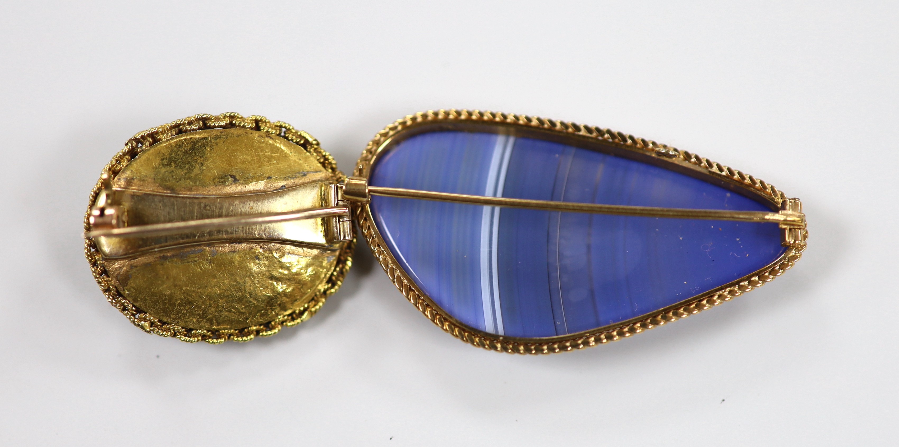 A modern 9ct gold mounted blue banded agate brooch, 47mm and an earlier yellow metal and turquoise cluster brooch, gross weight 25.3 grams.